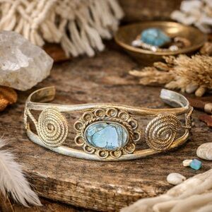 A soulful vintage cuff featuring luminous abalone shell